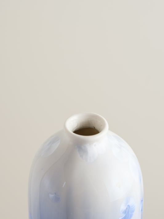 Tall crystalline glaze vase in gradient indigo blue with circular crystal bloom resembling a moon motif.