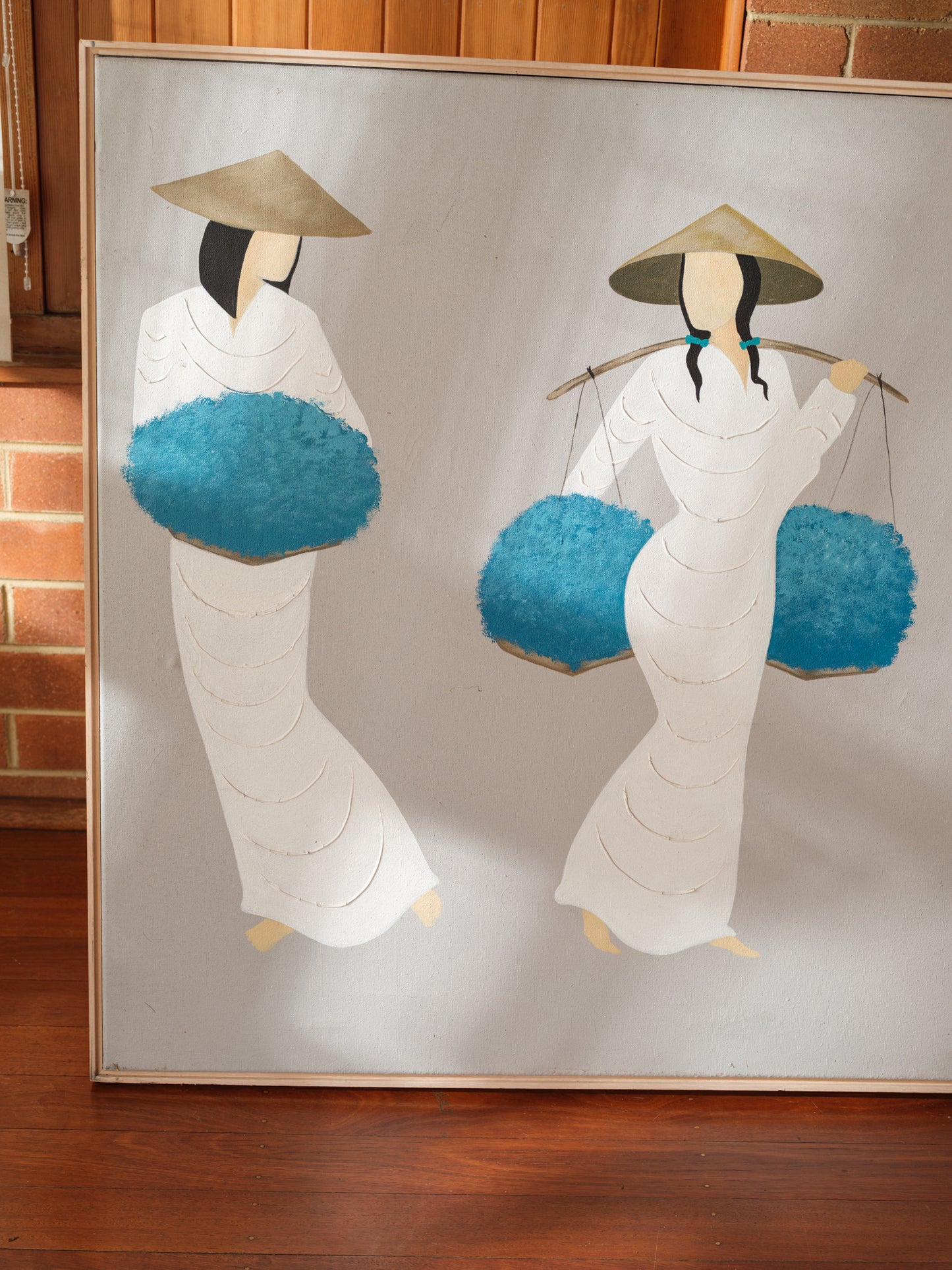Mixed-media artwork titled Azure Harvest Procession, showing five women in white garments and conical hats carrying vivid blue harvest baskets.