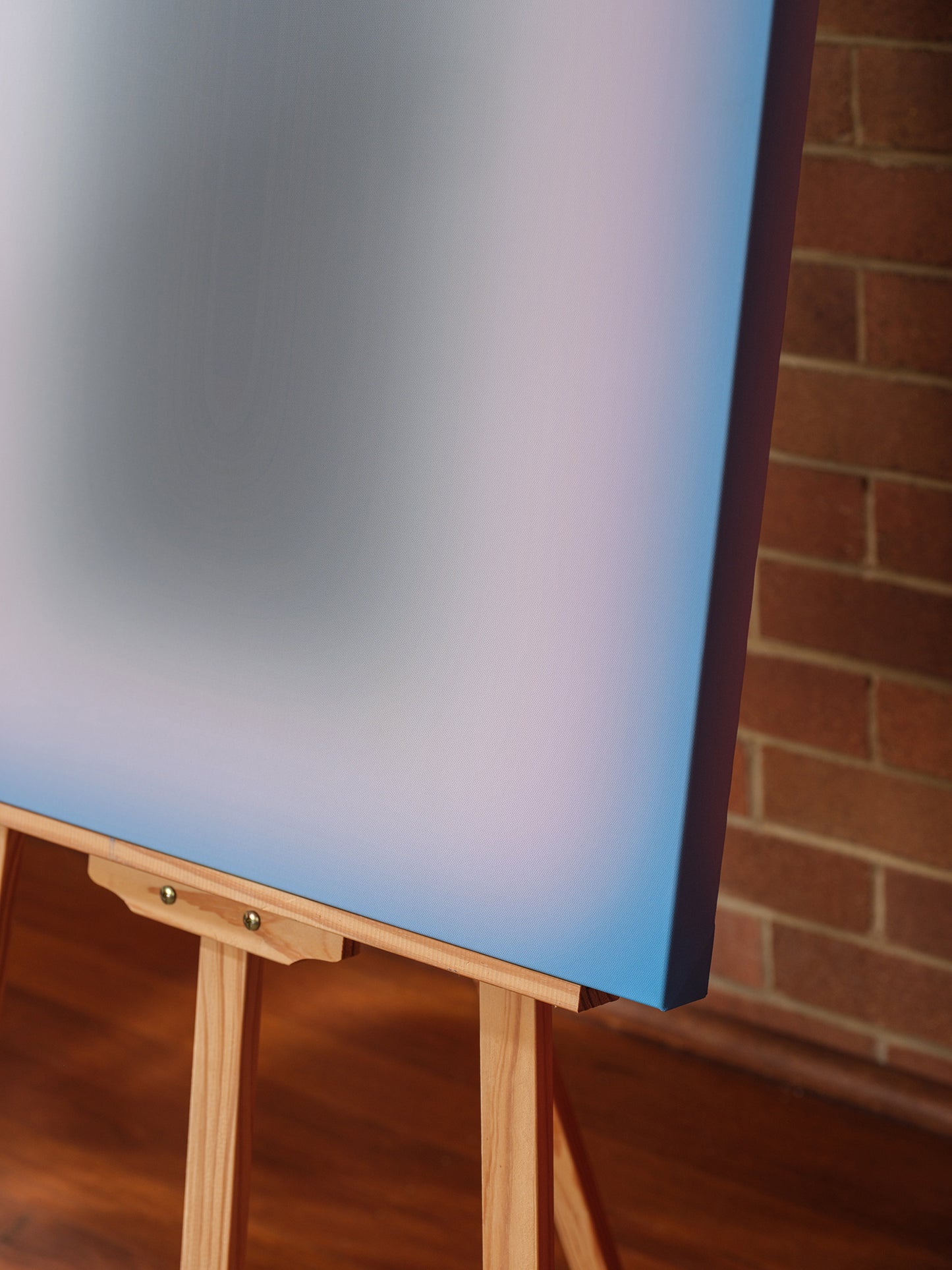 Fine art print titled Blue Aura Gradient, featuring a soft gradient of vivid blue tones surrounding a dark central core.