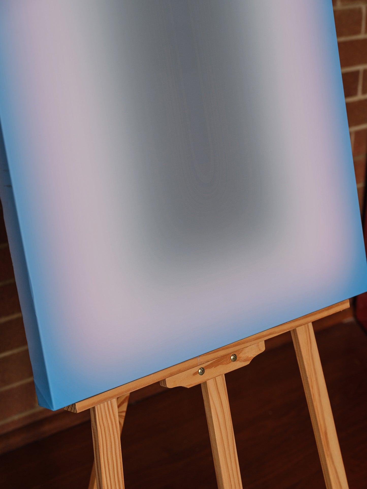 Fine art print titled Blue Aura Gradient, featuring a soft gradient of vivid blue tones surrounding a dark central core.