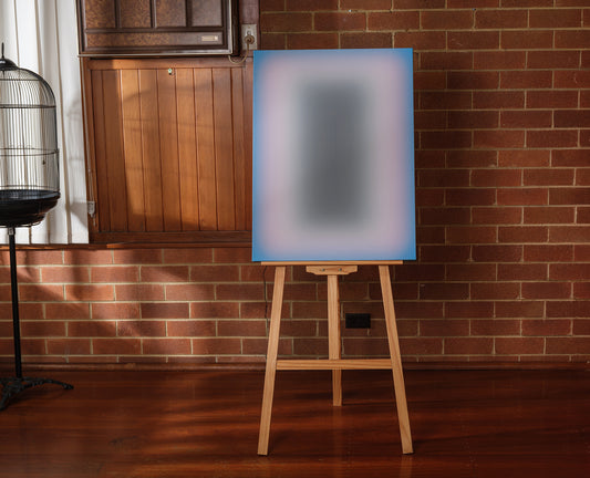 Fine art print titled Blue Aura Gradient, featuring a soft gradient of vivid blue tones surrounding a dark central core.