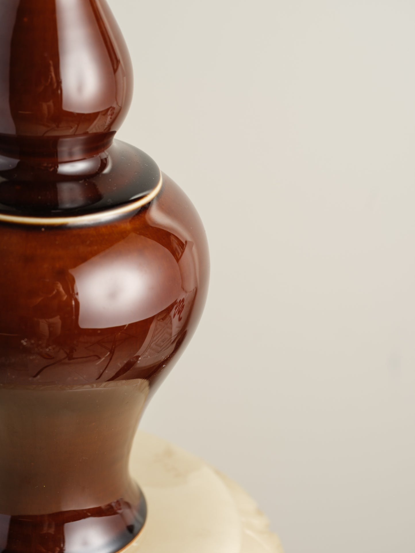 Ceramic meiping vase titled Chestnut Gloss, featuring a rich deep-brown glaze with a smooth reflective finish and elegant flared rim.