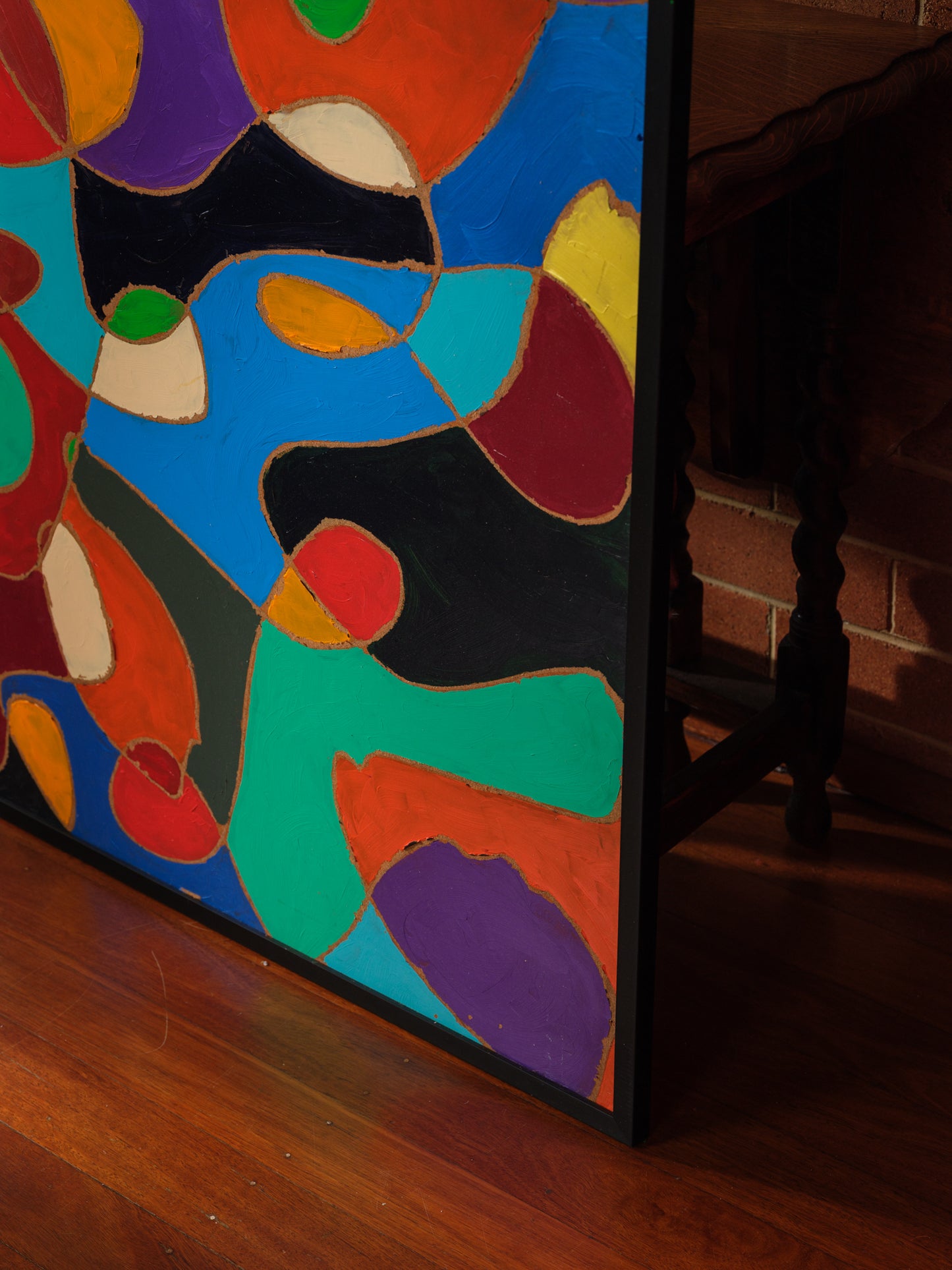 Abstract acrylic painting titled Chromatic Currents, featuring interwoven organic shapes in bold saturated colors with strong black outlines.