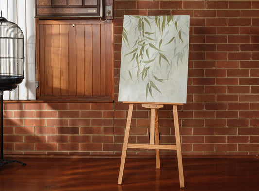 Abstract painting titled Eucalypt Reverie, featuring green eucalyptus leaves with soft brushstrokes on a light canvas background.