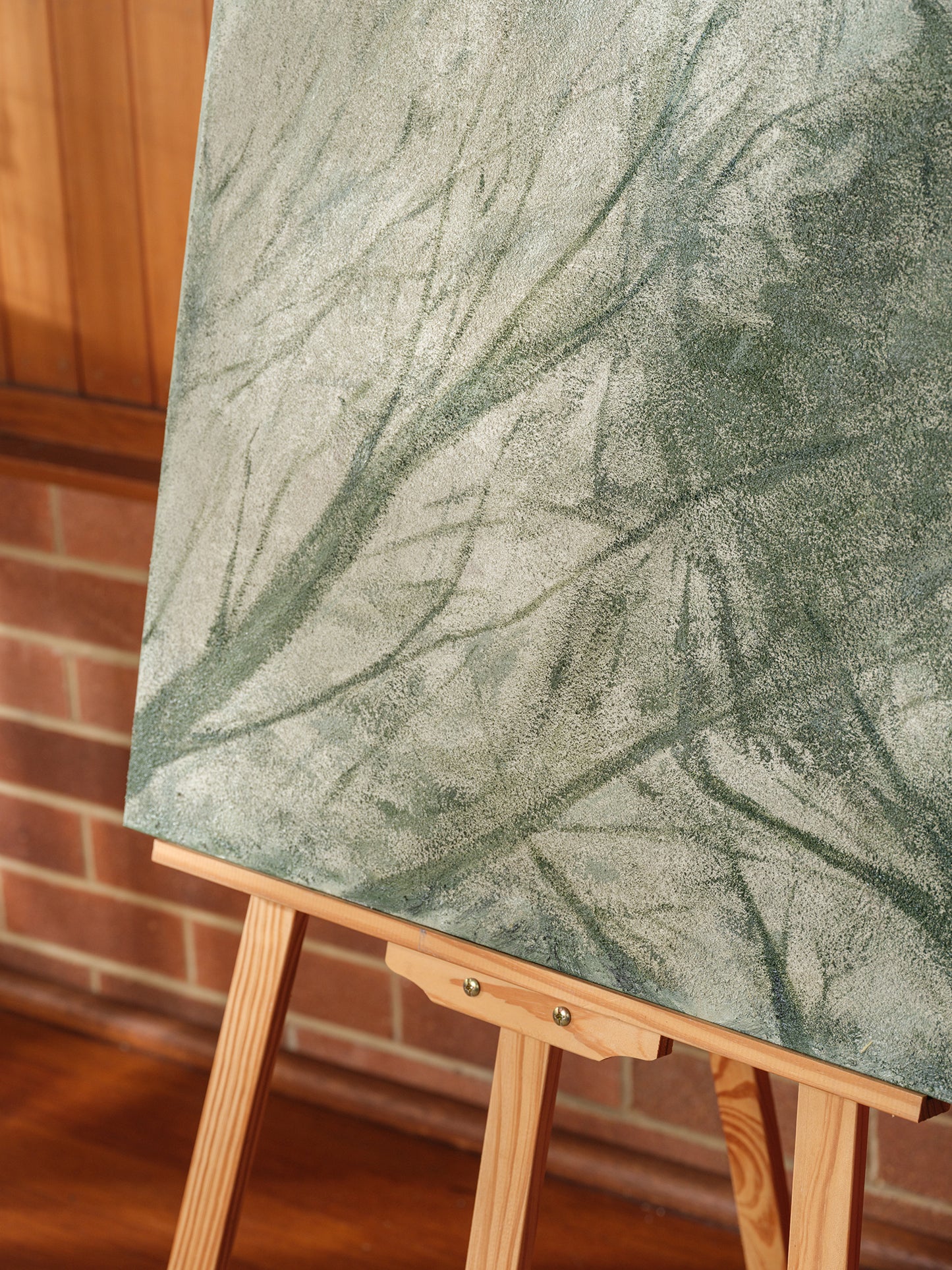 Abstract painting titled Forest Veil, featuring layered green brushstrokes resembling foliage on canvas.