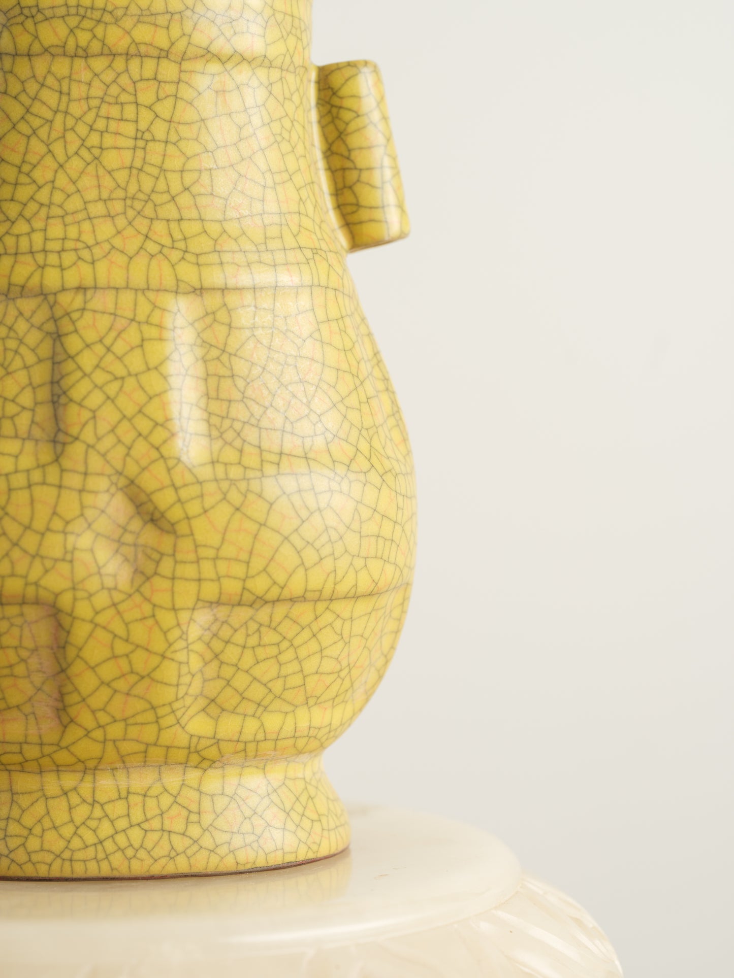 Golden Lattice Celadon Vase, featuring a yellow crackle glaze with geometric patterns and twin side handles.