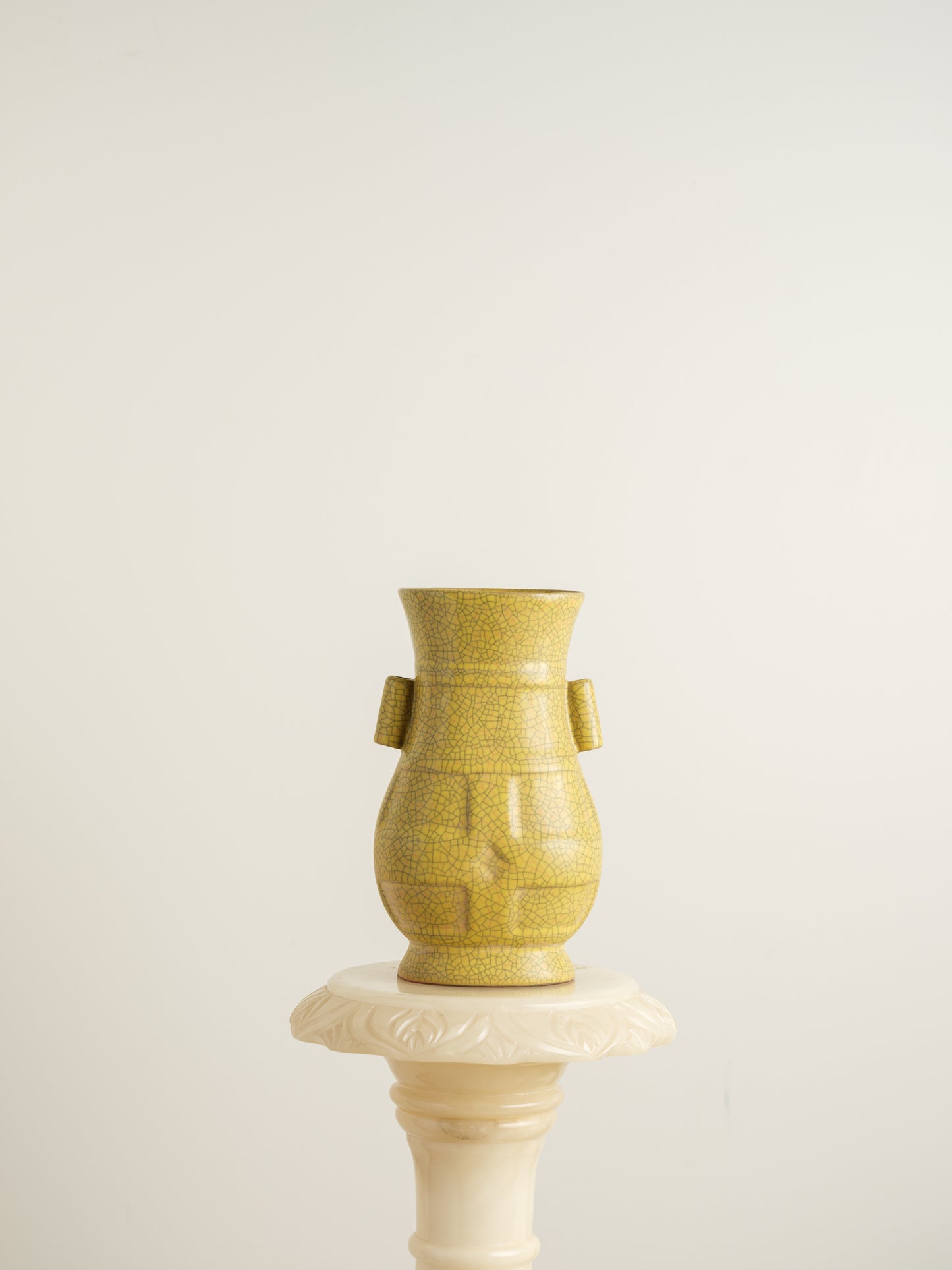 Golden Lattice Celadon Vase, featuring a yellow crackle glaze with geometric patterns and twin side handles.