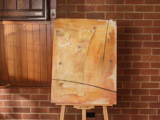 Abstract textured painting titled Golden Palimpsest, featuring layered golden ochre tones with subtle lines and organic forms on canvas.