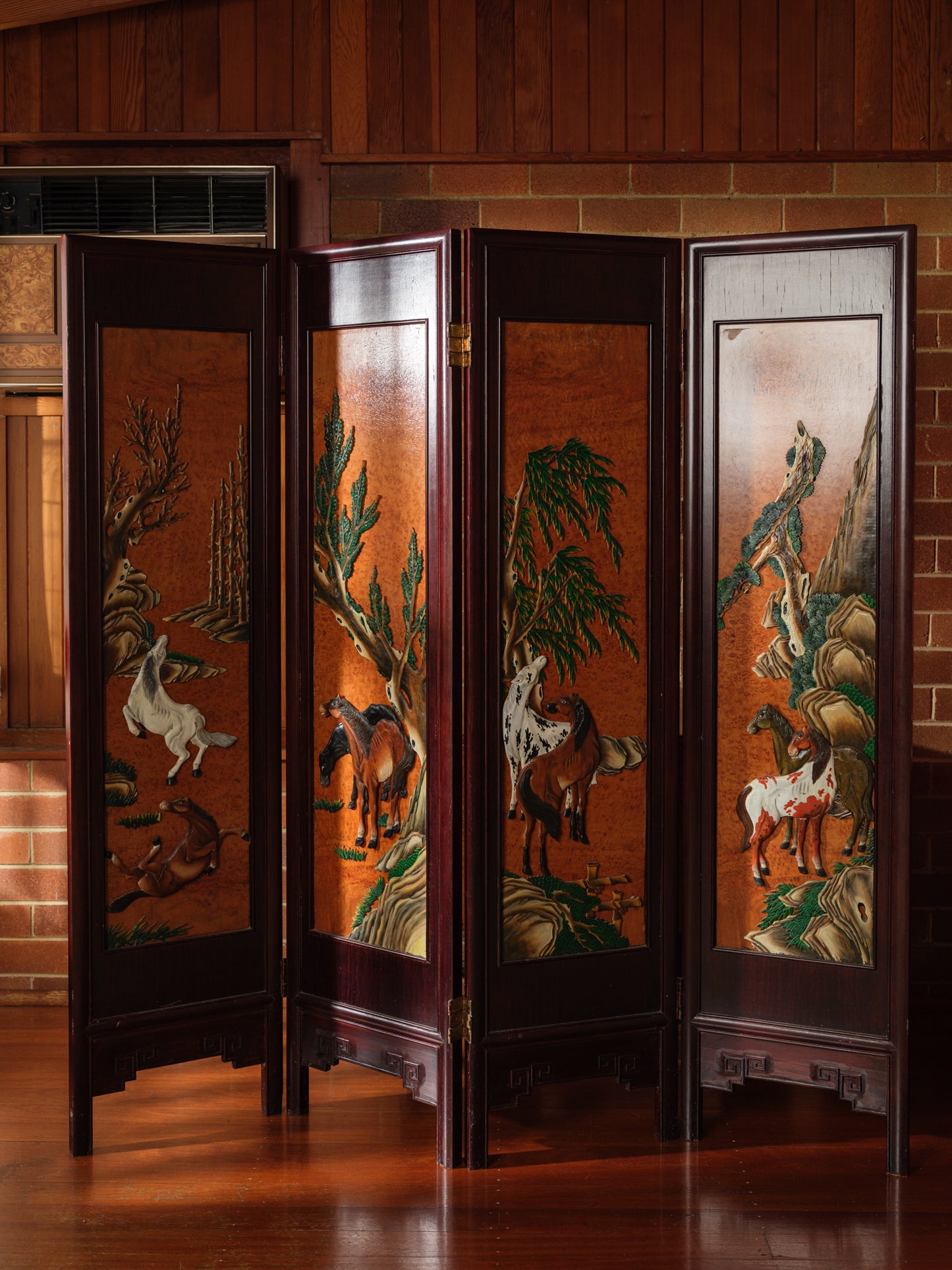 Four-panel wooden screen titled Herd Beneath the Pines, featuring hand-painted horses beneath pine trees in a traditional Chinese landscape style.