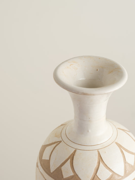 Ivory Blossom Sgraffito Vase, featuring hand-carved floral motifs in contrasting ivory and earthy tones with a traditional rounded body and flared neck.