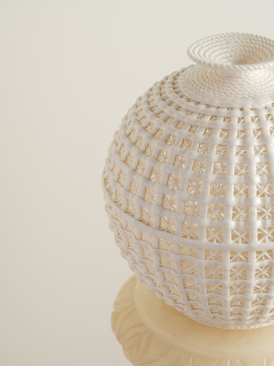 Ivory Lattice Orb Vase, spherical porcelain vase with intricate openwork lattice design and a delicate ivory finish.