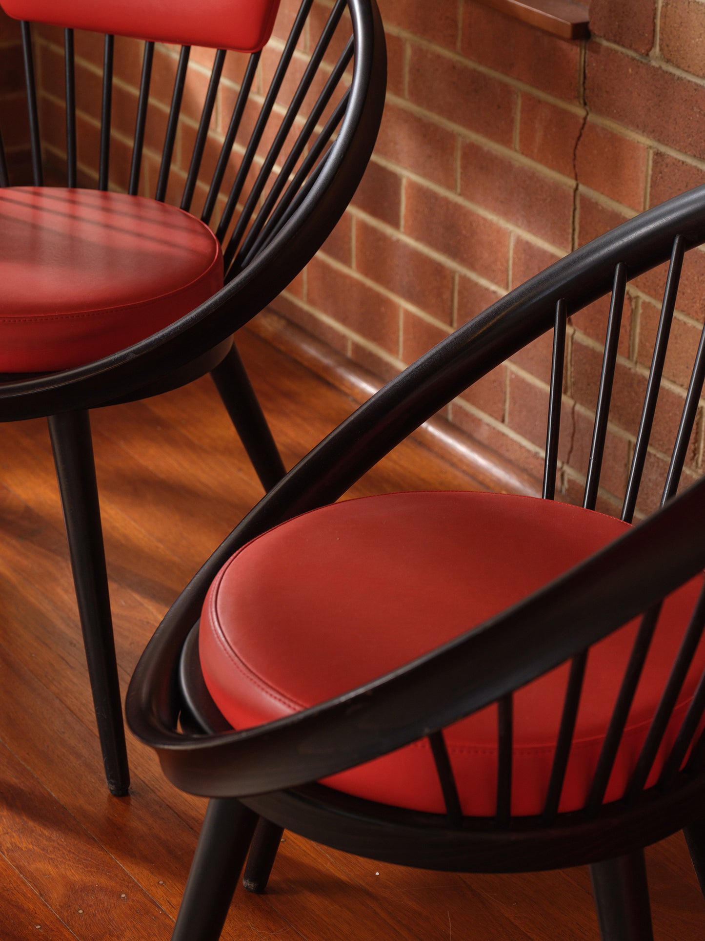 Vintage round chair by Yngve Ekström, 1960s design with black frame and red leather seat and backrest