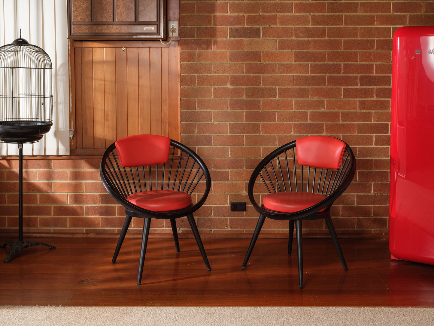 Vintage round chair by Yngve Ekström, 1960s design with black frame and red leather seat and backrest