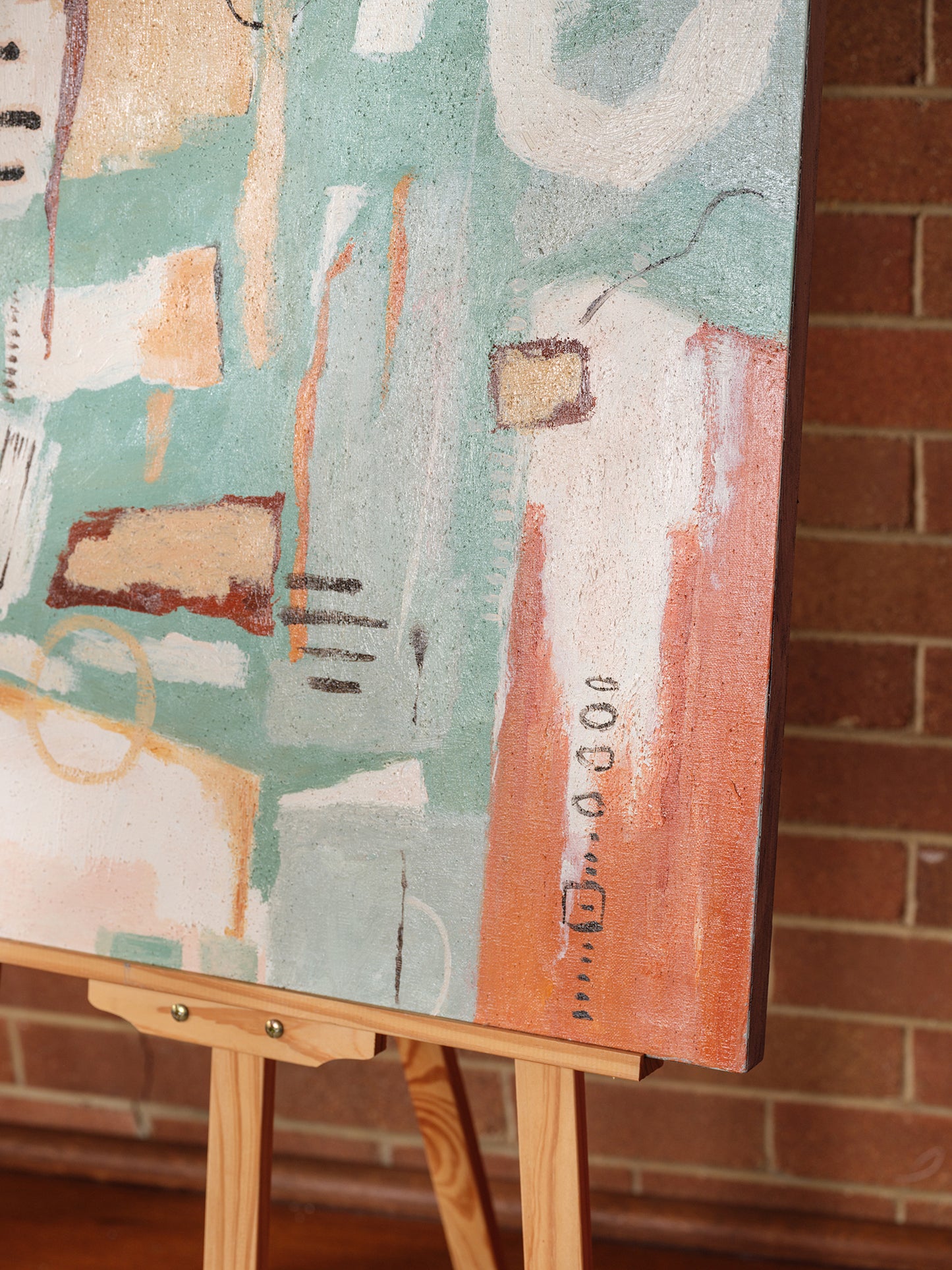 Abstract painting titled Soft Geometry at Dusk, featuring pastel orange, teal, and blush geometric shapes with expressive brushstrokes on canvas.