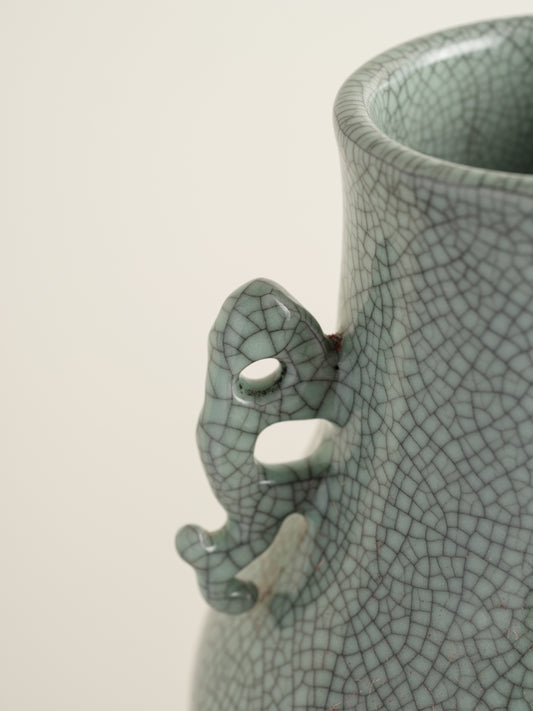 Song Mist Celadon Hu Vase, featuring a pale green crackle glaze with ornate side handles and a traditional hu form.