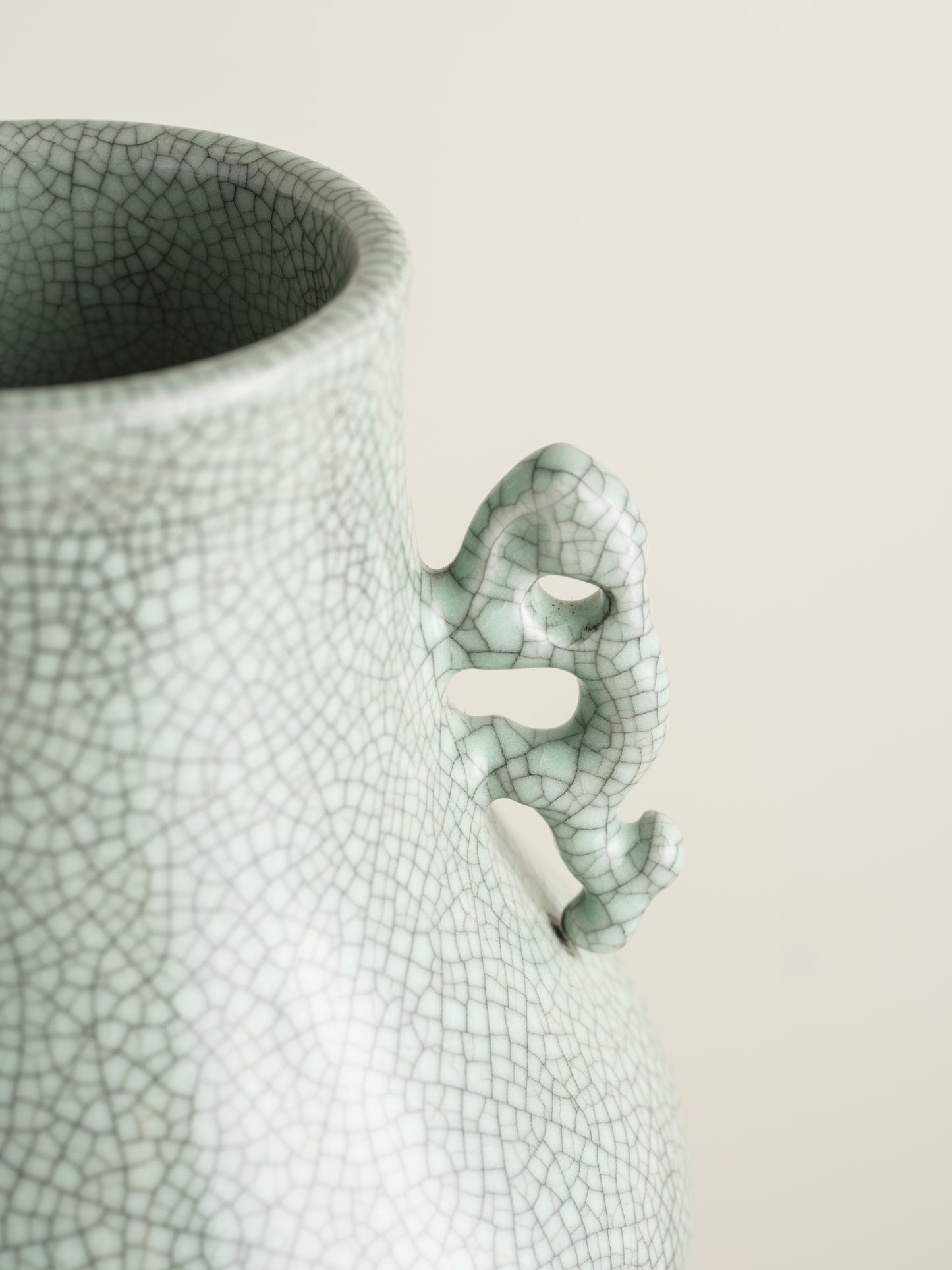 Song Mist Celadon Hu Vase, featuring a pale green crackle glaze with ornate side handles and a traditional hu form.