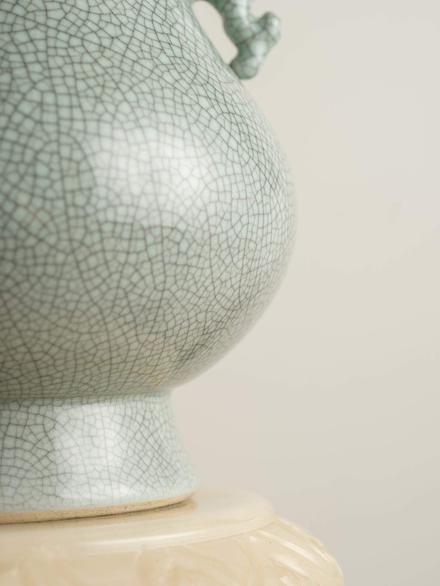 Song Mist Celadon Hu Vase, featuring a pale green crackle glaze with ornate side handles and a traditional hu form.