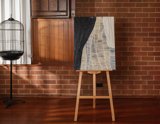 Abstract textured painting titled Tidal Strata II, featuring layered vertical bands in cream, beige, and charcoal tones on canvas.