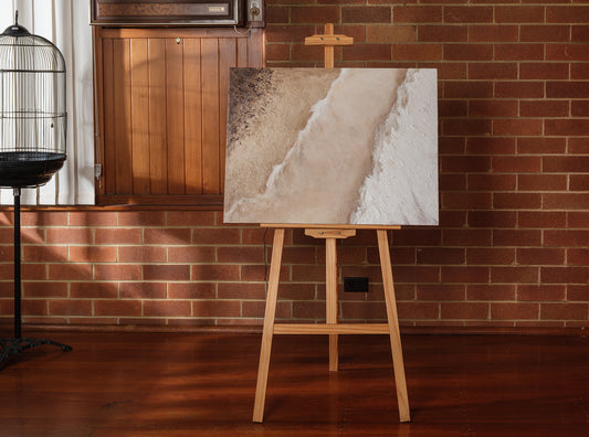 Abstract textured painting titled Tideworn Dune, featuring layered sandy beige and white tones evoking coastal dunes on canvas.
