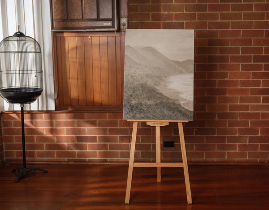 Abstract painting titled Whisper of the Inlet, featuring textured neutral tones of beige, grey, and white depicting a serene coastal landscape.