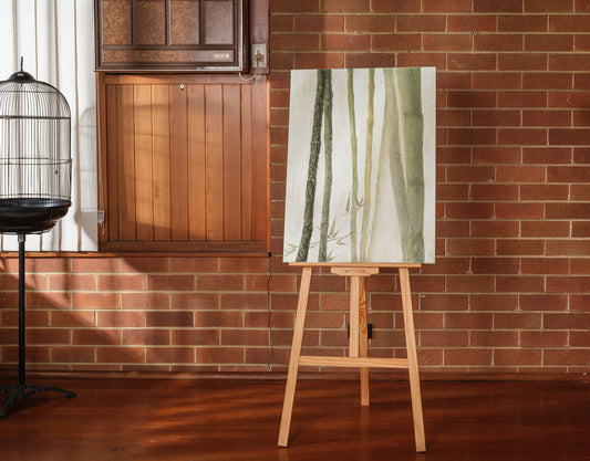 Abstract painting titled Whispering Bamboo, featuring vertical green and white brushstrokes resembling bamboo on canvas.