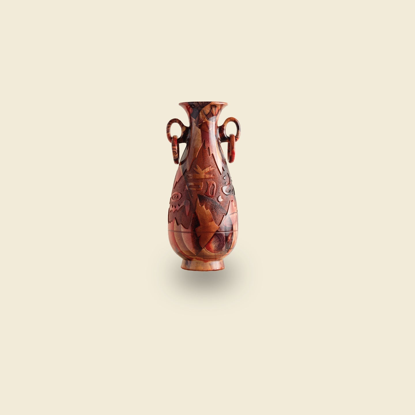 Hand-carved decorative vase with intricate patterns and twin loop handles, featured in the SYP Homes Objects Collection.