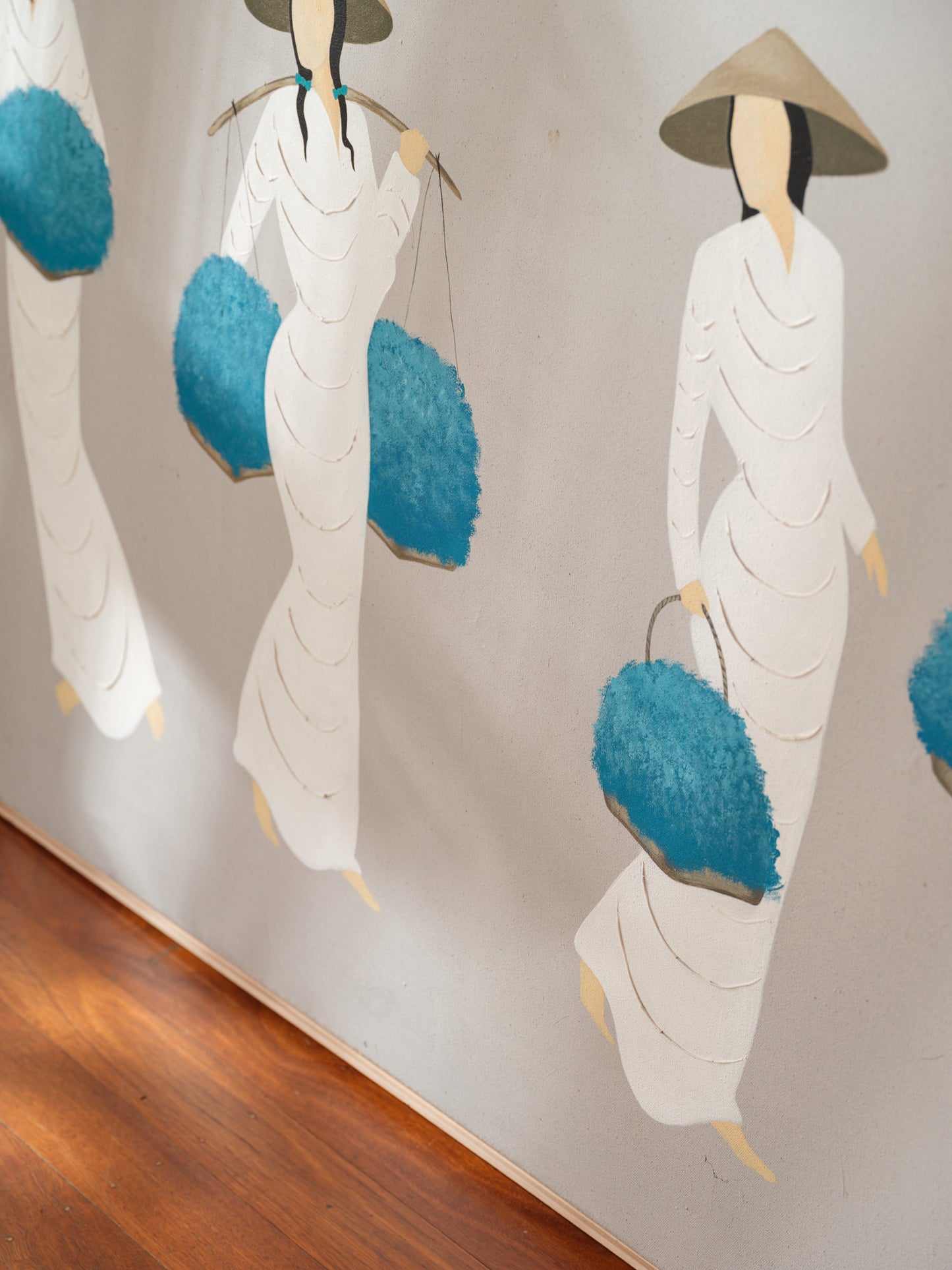 Mixed-media artwork titled Azure Harvest Procession, showing five women in white garments and conical hats carrying vivid blue harvest baskets.