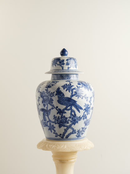 Blue and white porcelain ginger jar with phoenix and floral motif.