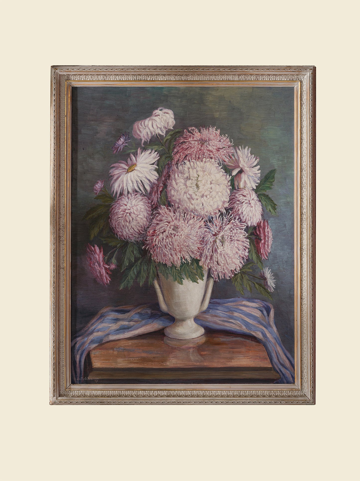 Oil painting titled Blush Chrysanthemums in White Vase, featuring a lush bouquet of pink chrysanthemums arranged in a classic white vase with a striped blue cloth.