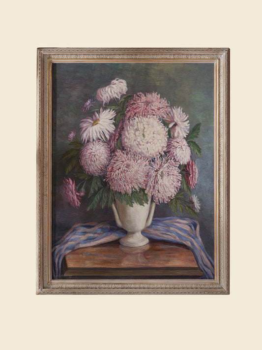 Oil painting titled Blush Chrysanthemums in White Vase, featuring a lush bouquet of pink chrysanthemums arranged in a classic white vase with a striped blue cloth.