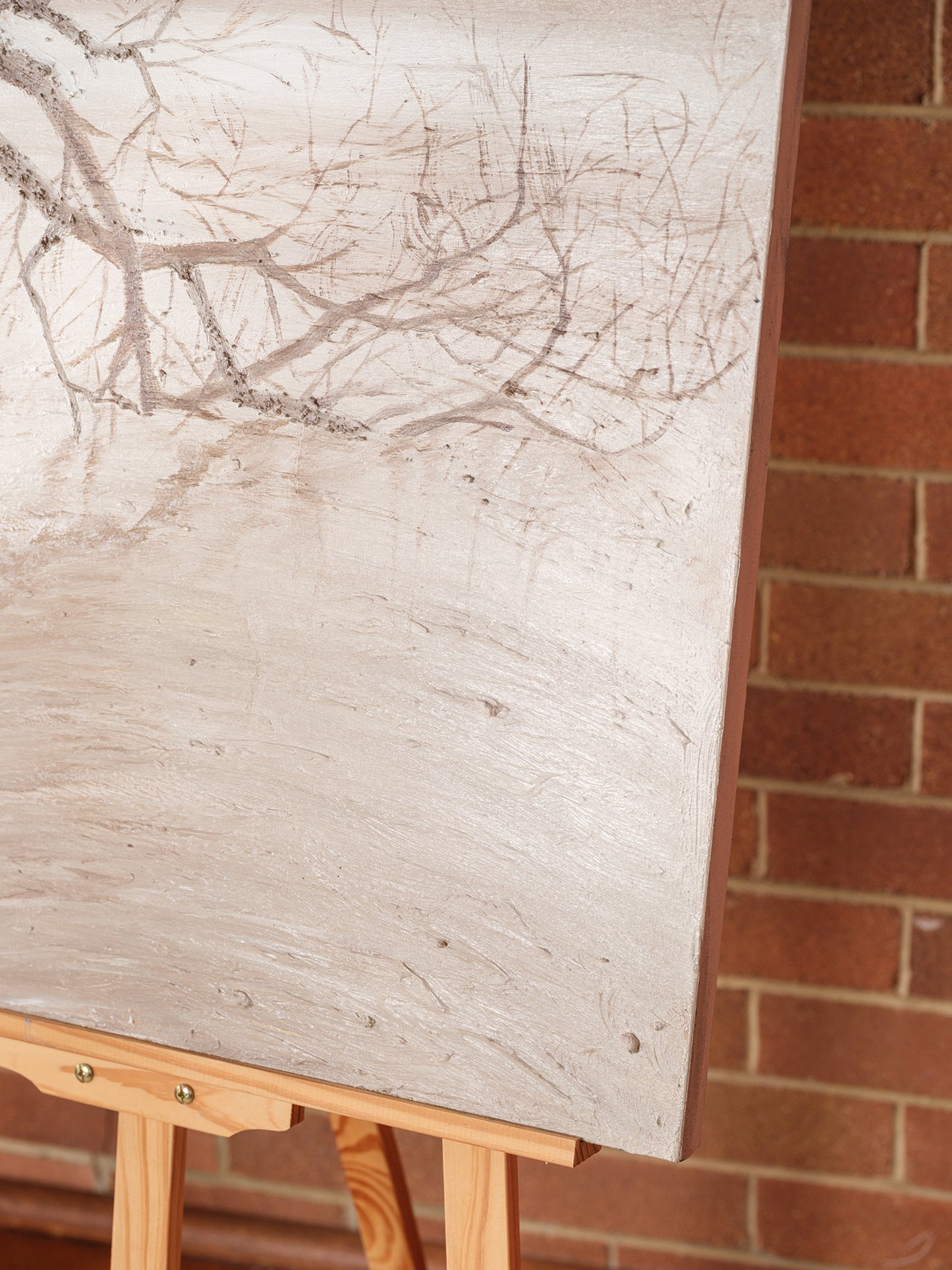 Abstract painting titled Blush in the Breeze, featuring soft beige and blush tones with a tree branch in a tranquil landscape.