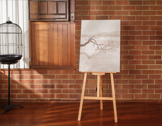 Abstract painting titled Blush in the Breeze, featuring soft beige and blush tones with a tree branch in a tranquil landscape.