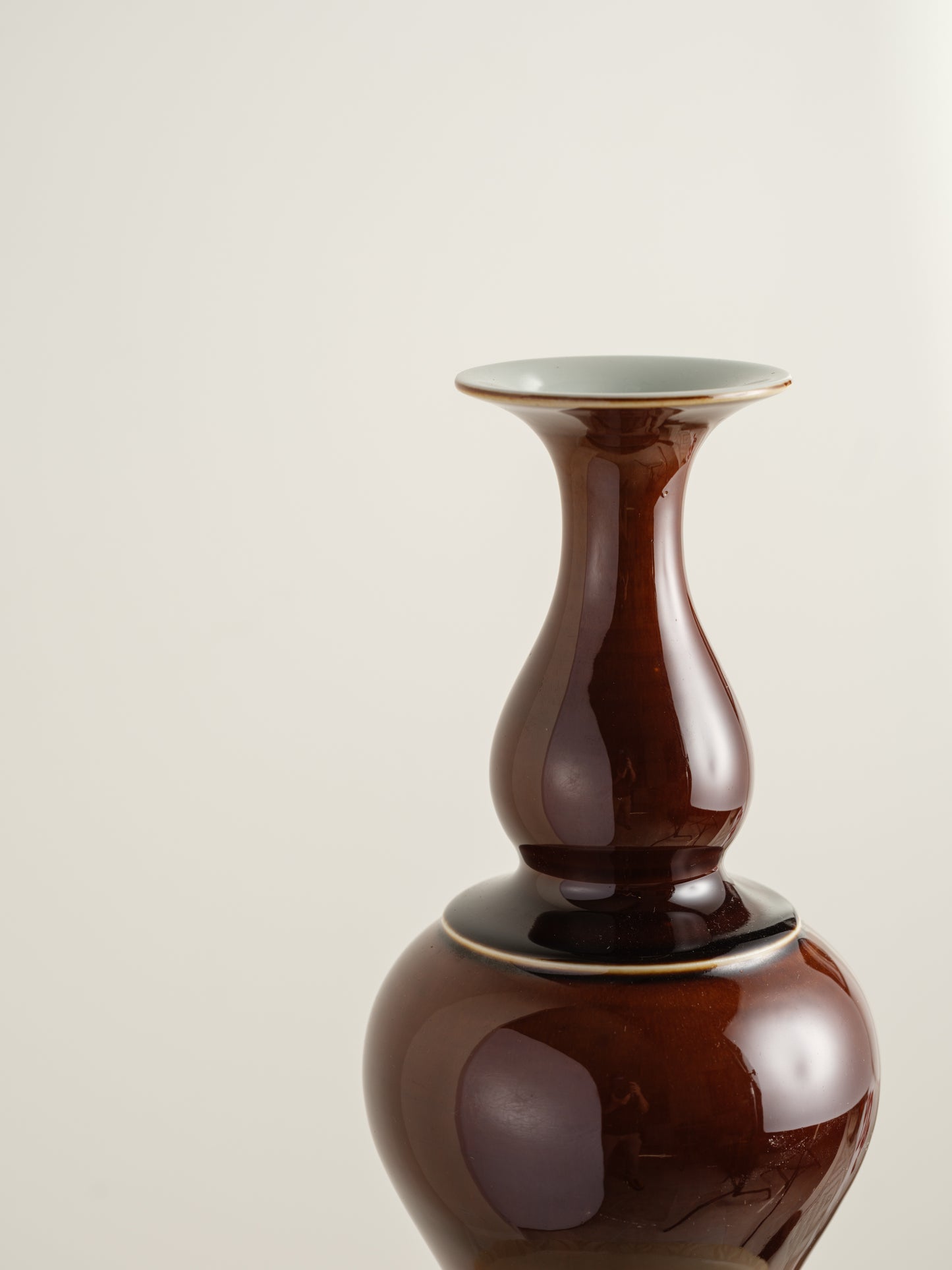 Ceramic meiping vase titled Chestnut Gloss, featuring a rich deep-brown glaze with a smooth reflective finish and elegant flared rim.
