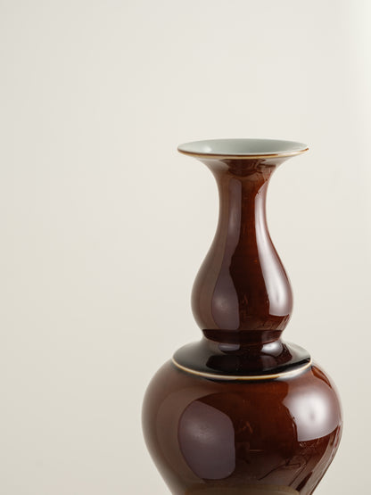 Ceramic meiping vase titled Chestnut Gloss, featuring a rich deep-brown glaze with a smooth reflective finish and elegant flared rim.
