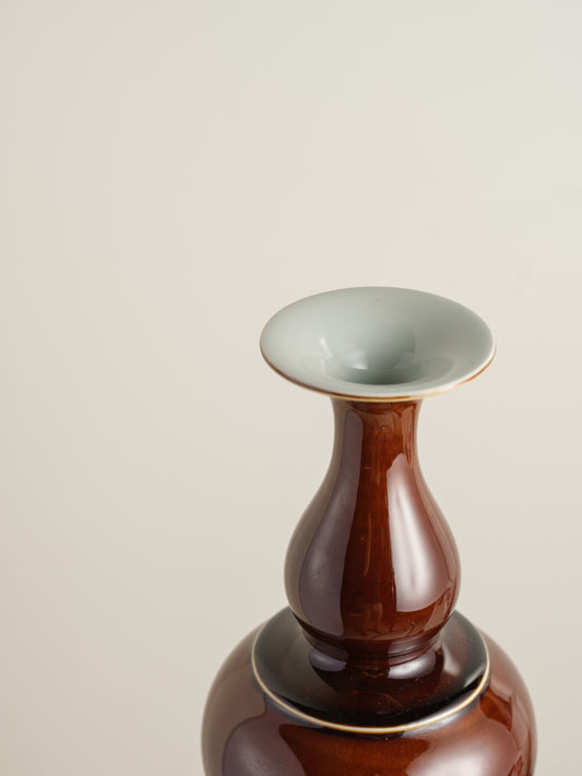 Ceramic meiping vase titled Chestnut Gloss, featuring a rich deep-brown glaze with a smooth reflective finish and elegant flared rim.
