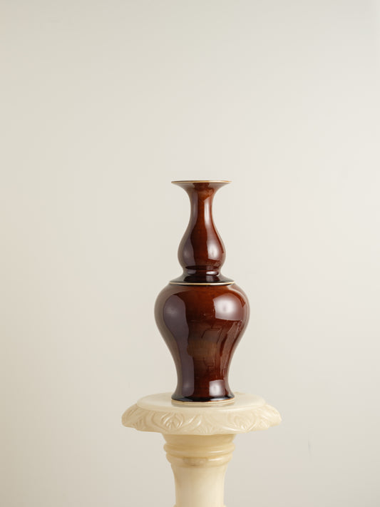 Ceramic meiping vase titled Chestnut Gloss, featuring a rich deep-brown glaze with a smooth reflective finish and elegant flared rim.
