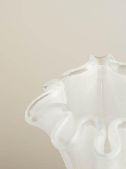 White opaline glass vase with softly ruffled petal rim and cloud-like translucence.
