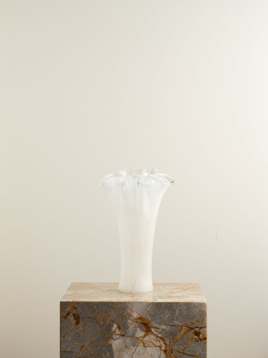 White opaline glass vase with softly ruffled petal rim and cloud-like translucence.
