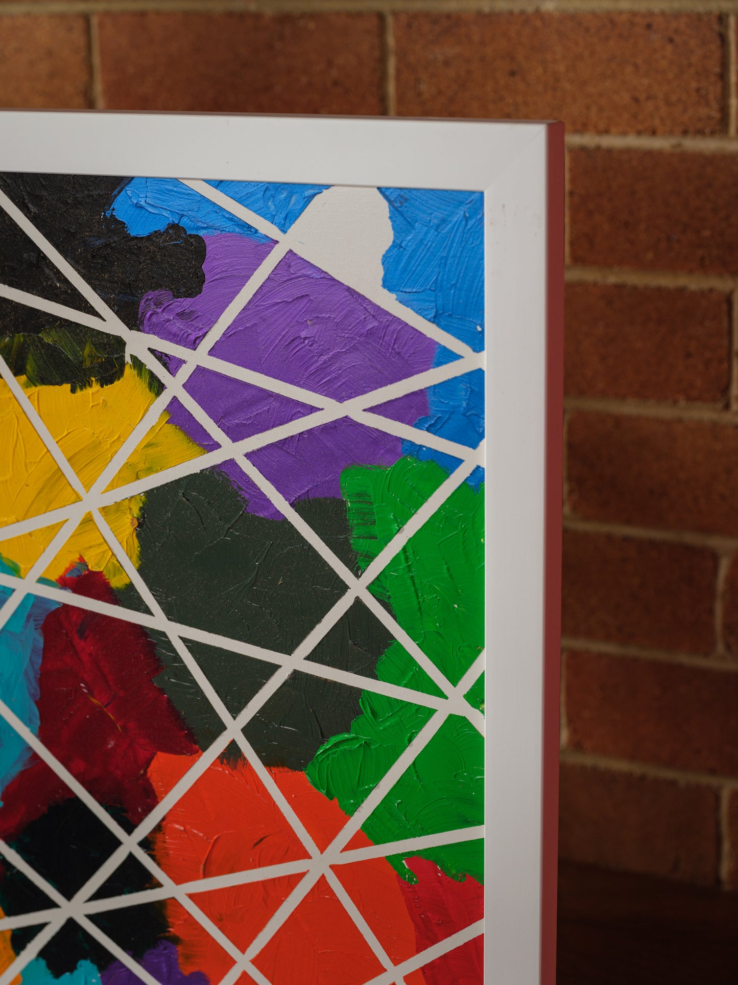 Abstract acrylic painting titled Constellations of Color, featuring vibrant patches of bold hues intersected with geometric white lines.