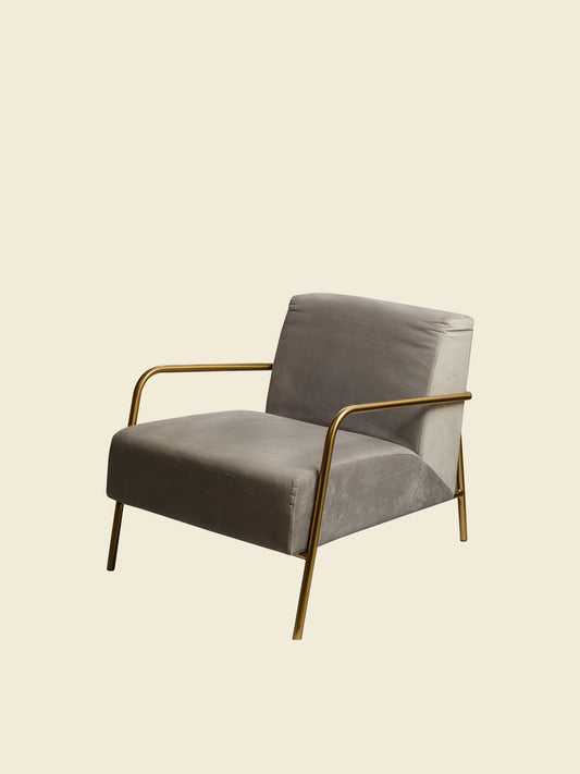 Contemporary lounge accent chair with soft grey upholstery and gold metal frame