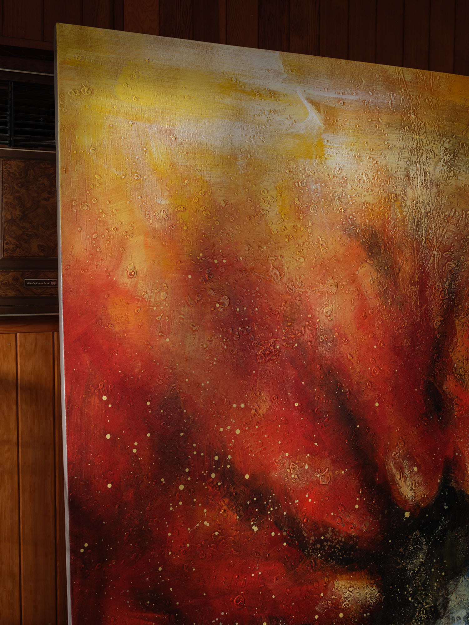 Mixed-media abstract artwork titled Ember Vortex, featuring fiery red, gold, and black tones with layered textures and dynamic energy.