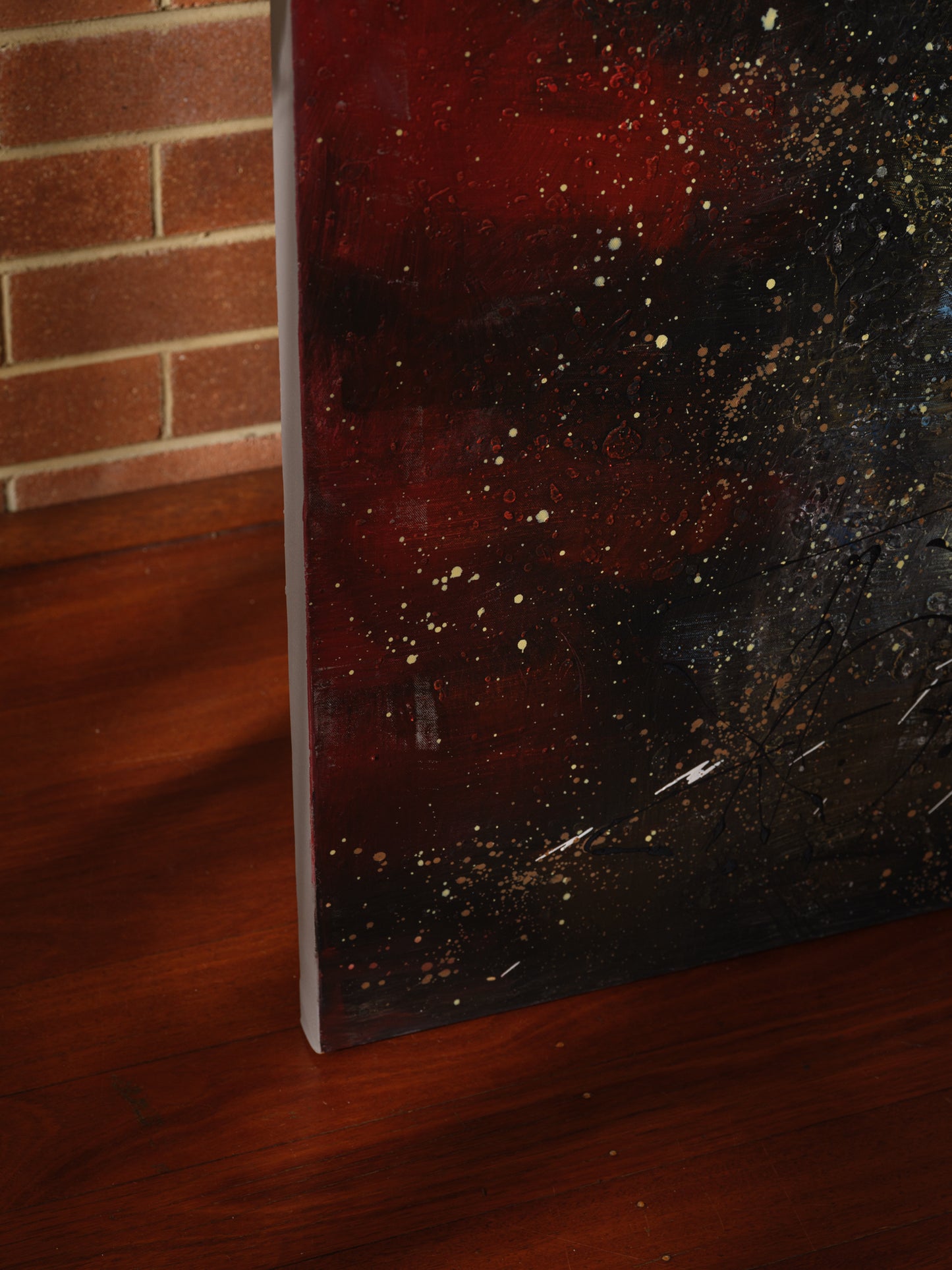 Mixed-media abstract artwork titled Ember Vortex, featuring fiery red, gold, and black tones with layered textures and dynamic energy.