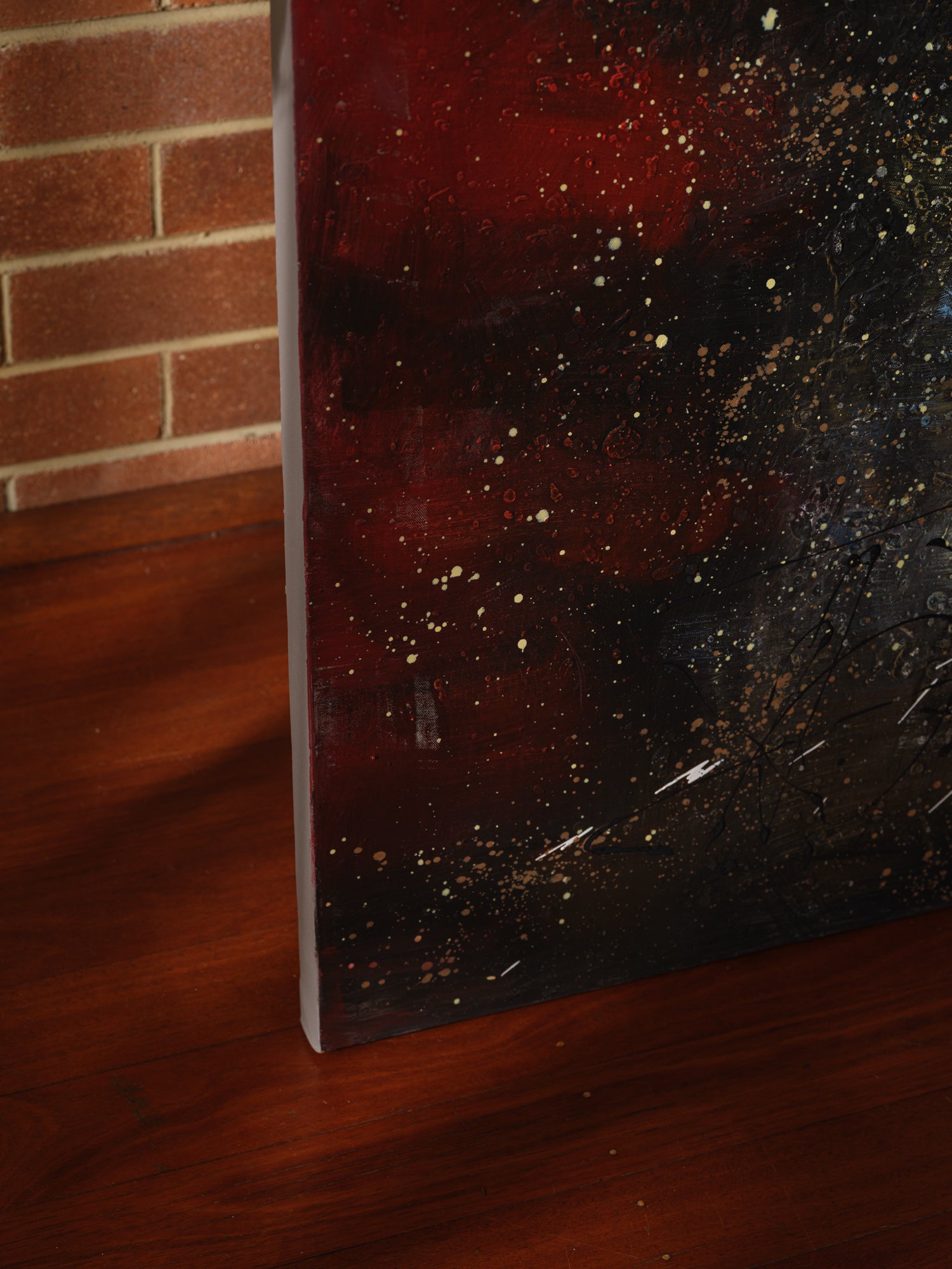 Mixed-media abstract artwork titled Ember Vortex, featuring fiery red, gold, and black tones with layered textures and dynamic energy.