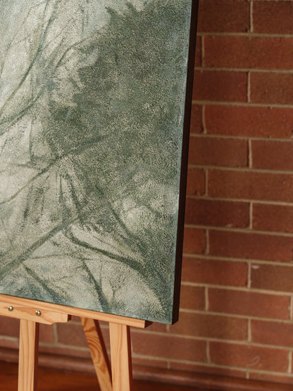 Abstract painting titled Forest Veil, featuring layered green brushstrokes resembling foliage on canvas.