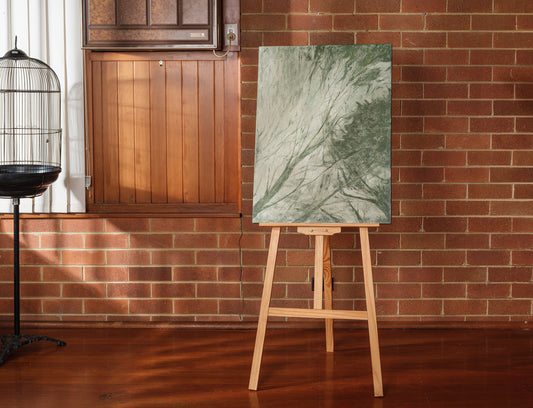 Abstract painting titled Forest Veil, featuring layered green brushstrokes resembling foliage on canvas.