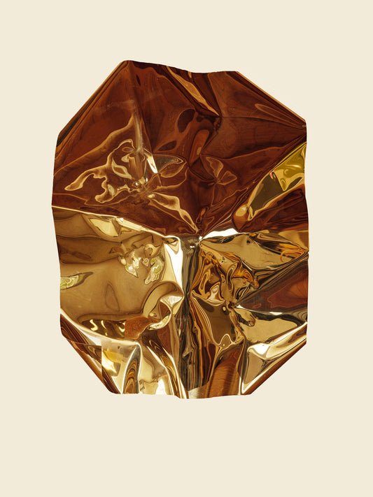 Sculpture titled Gilded Fold, made of polished stainless steel with a reflective golden surface and folded geometric form.