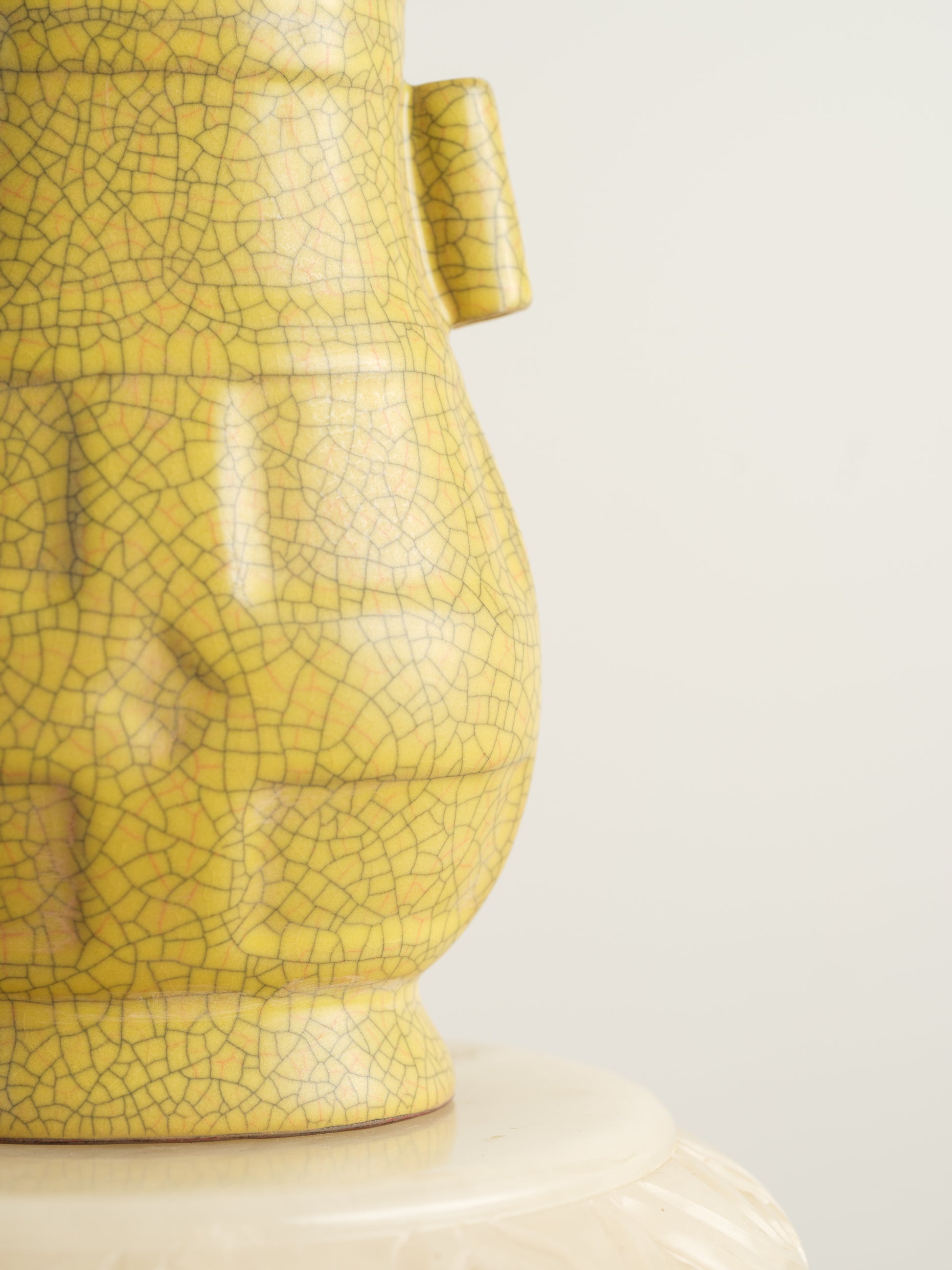 Golden Lattice Celadon Vase, featuring a yellow crackle glaze with geometric patterns and twin side handles.