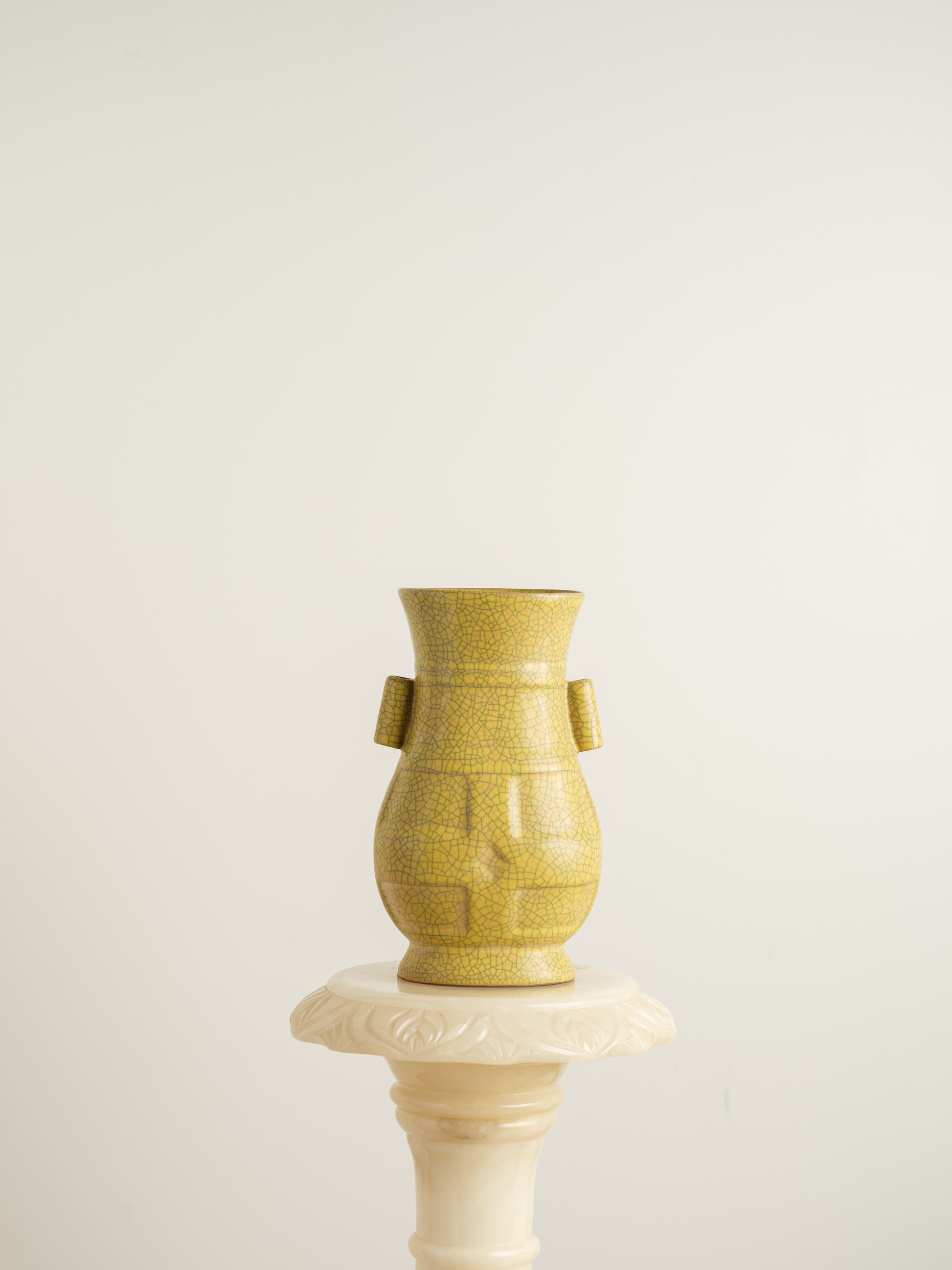 Golden Lattice Celadon Vase, featuring a yellow crackle glaze with geometric patterns and twin side handles.