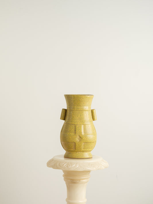 Golden Lattice Celadon Vase, featuring a yellow crackle glaze with geometric patterns and twin side handles.
