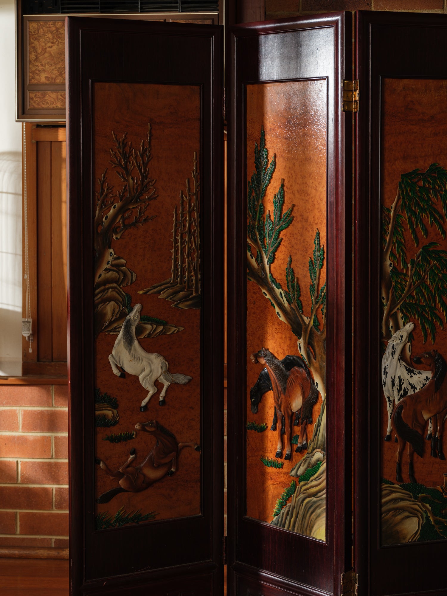 Four-panel wooden screen titled Herd Beneath the Pines, featuring hand-painted horses beneath pine trees in a traditional Chinese landscape style.